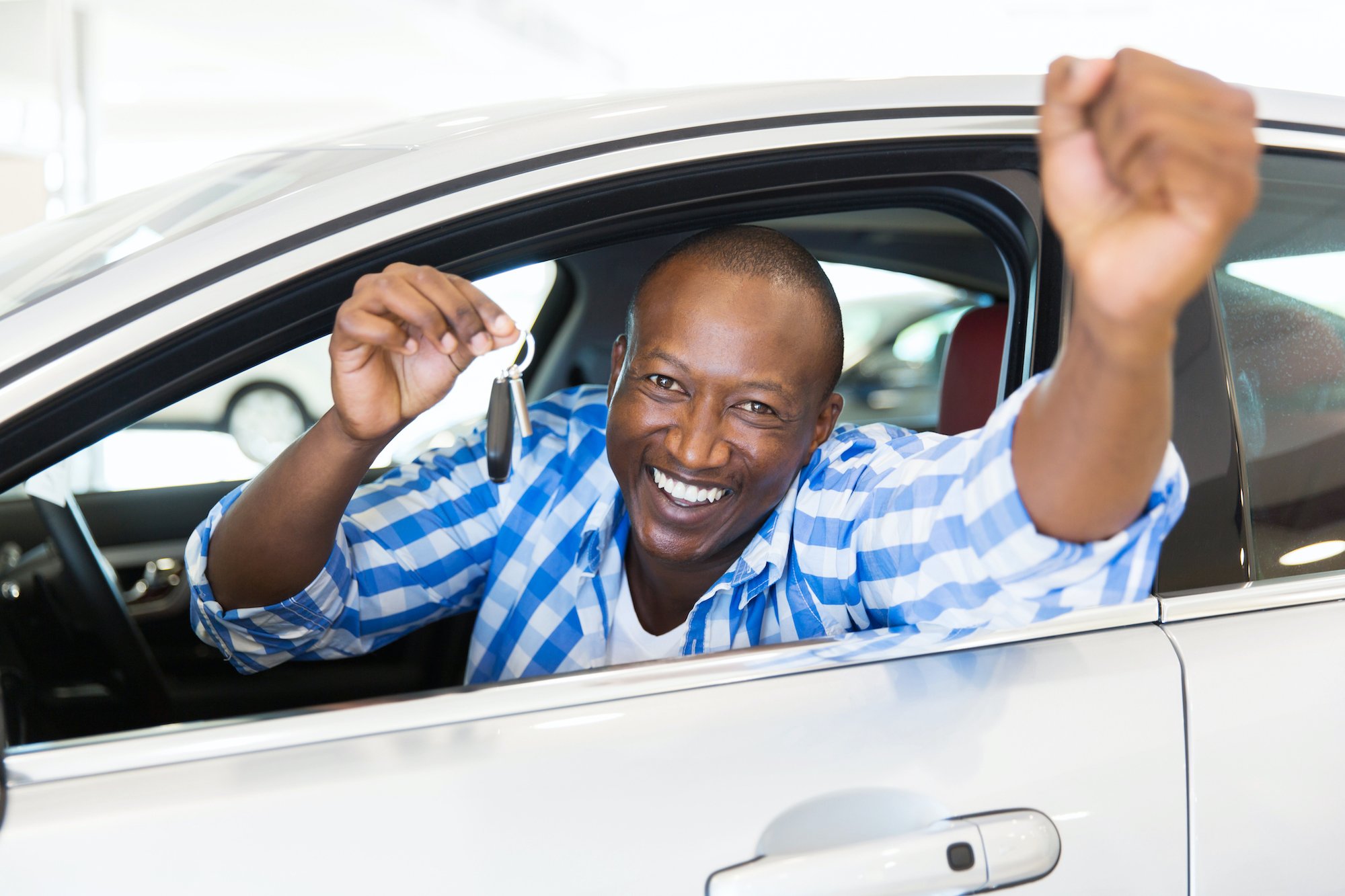 man smileing with keys