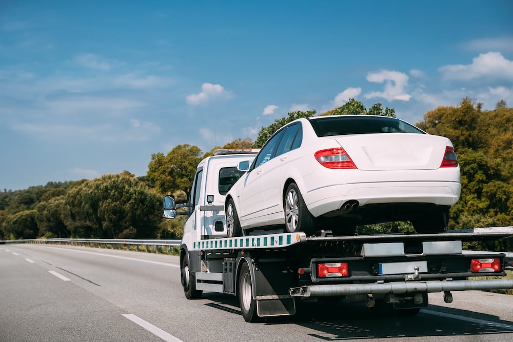 Car Service Transportation Concept. Tow Truck Transporting Car Or Help On Road Transports Wrecker Broken Car. Auto Towing, Tow Truck For Transportation Faults And Emergency Cars . Tow Truck Moving In Motorway Freeway Highway.